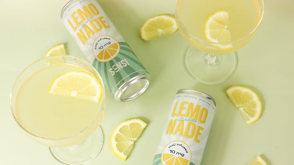 sip sensi lemonade can with lemons and martini glasses