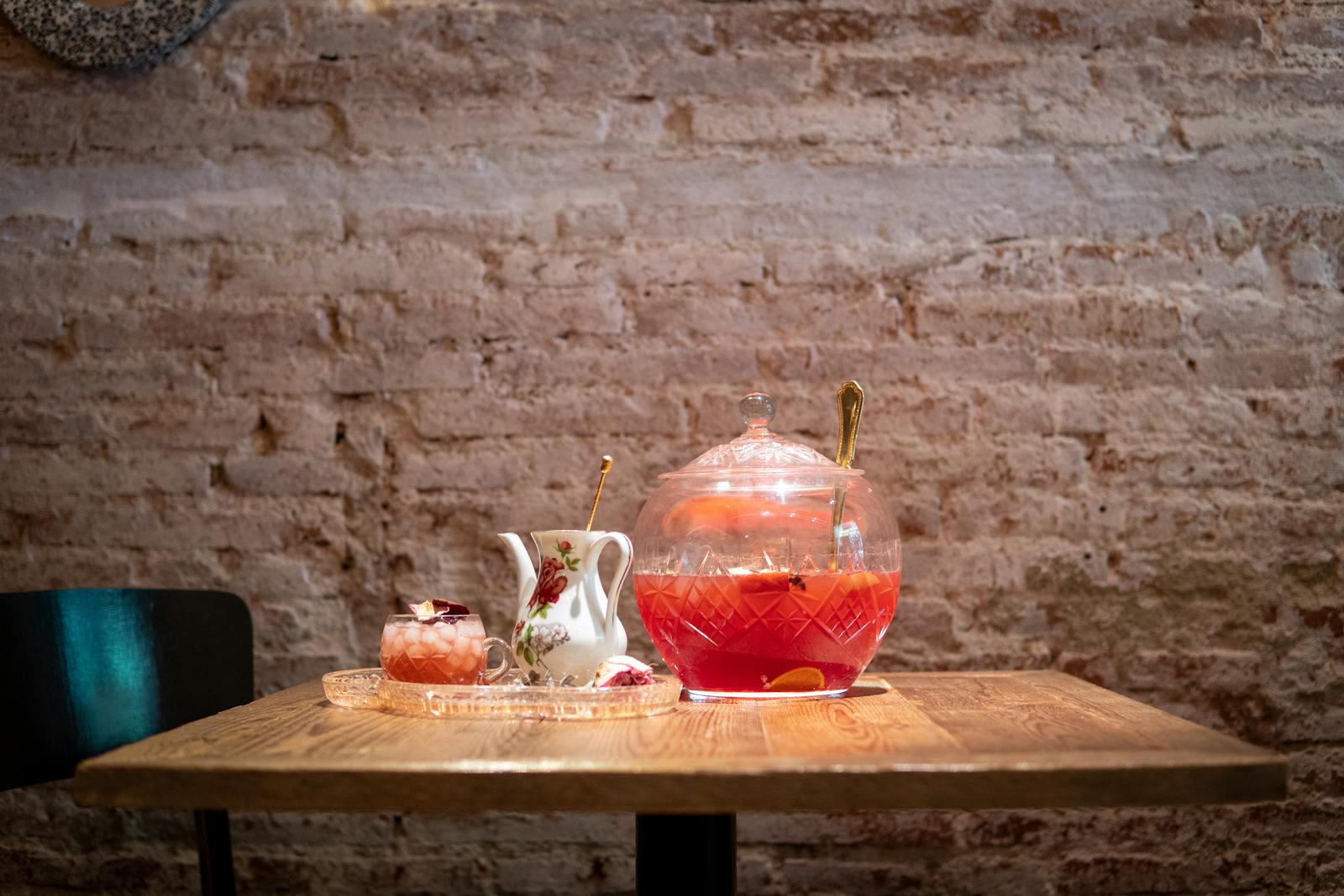 Punch bowl and glass on wooden table