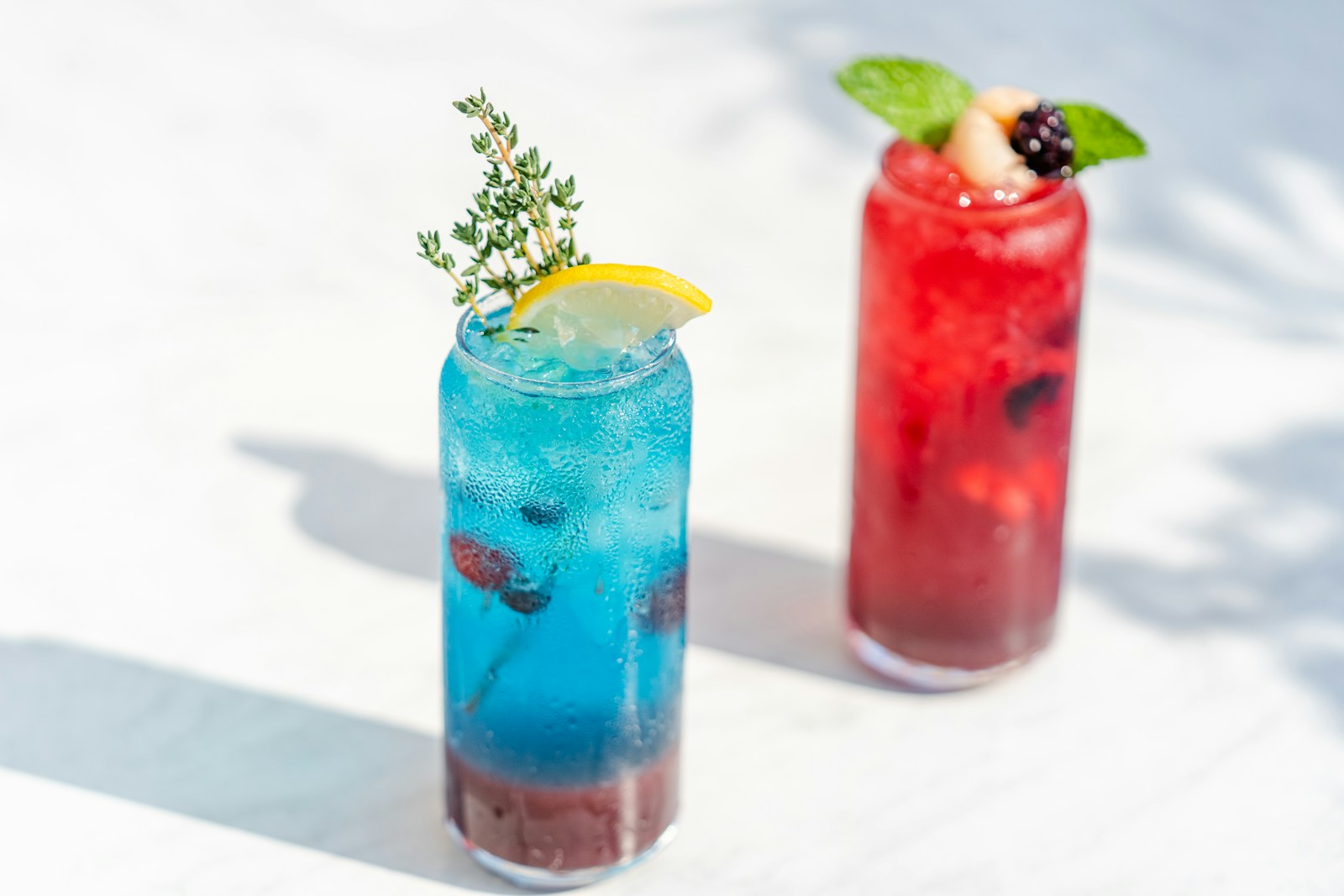 Colorful refreshing summer cocktails on table