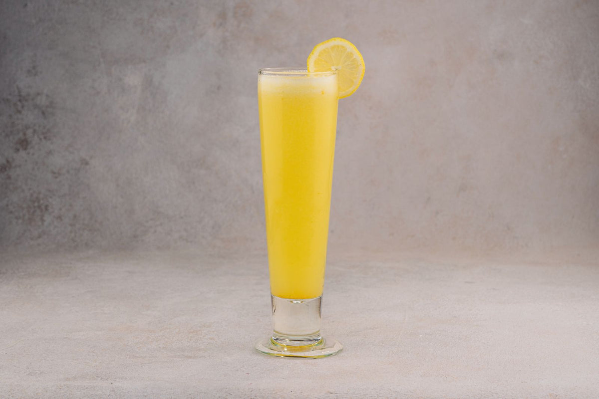 Refreshing lemon juice in tall glass