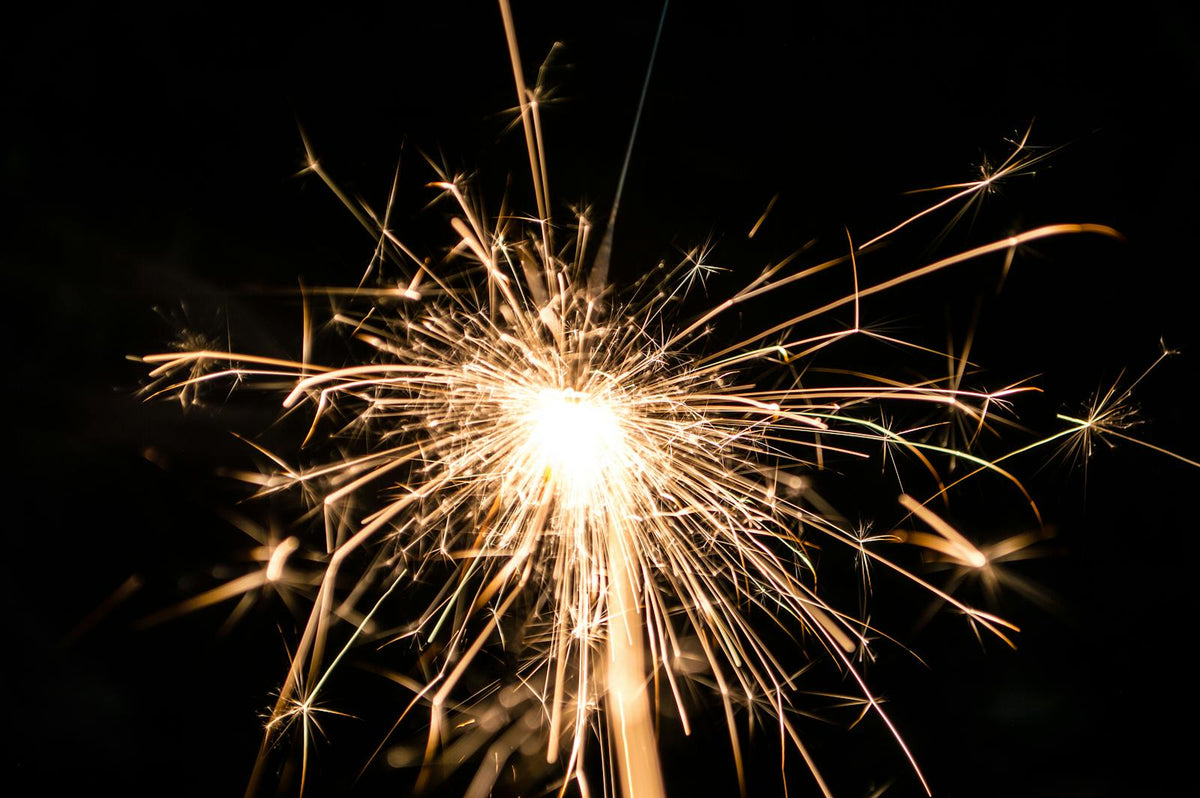 Bright sparkling fireworks in dark sky