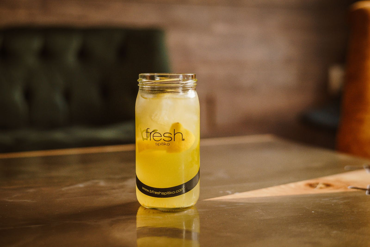 Lemon drink in mason jar on table