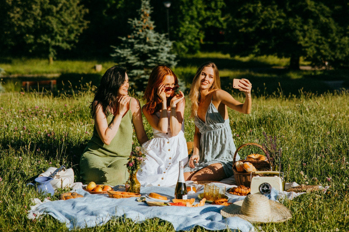 Friends enjoying a sunny picnic outdoors