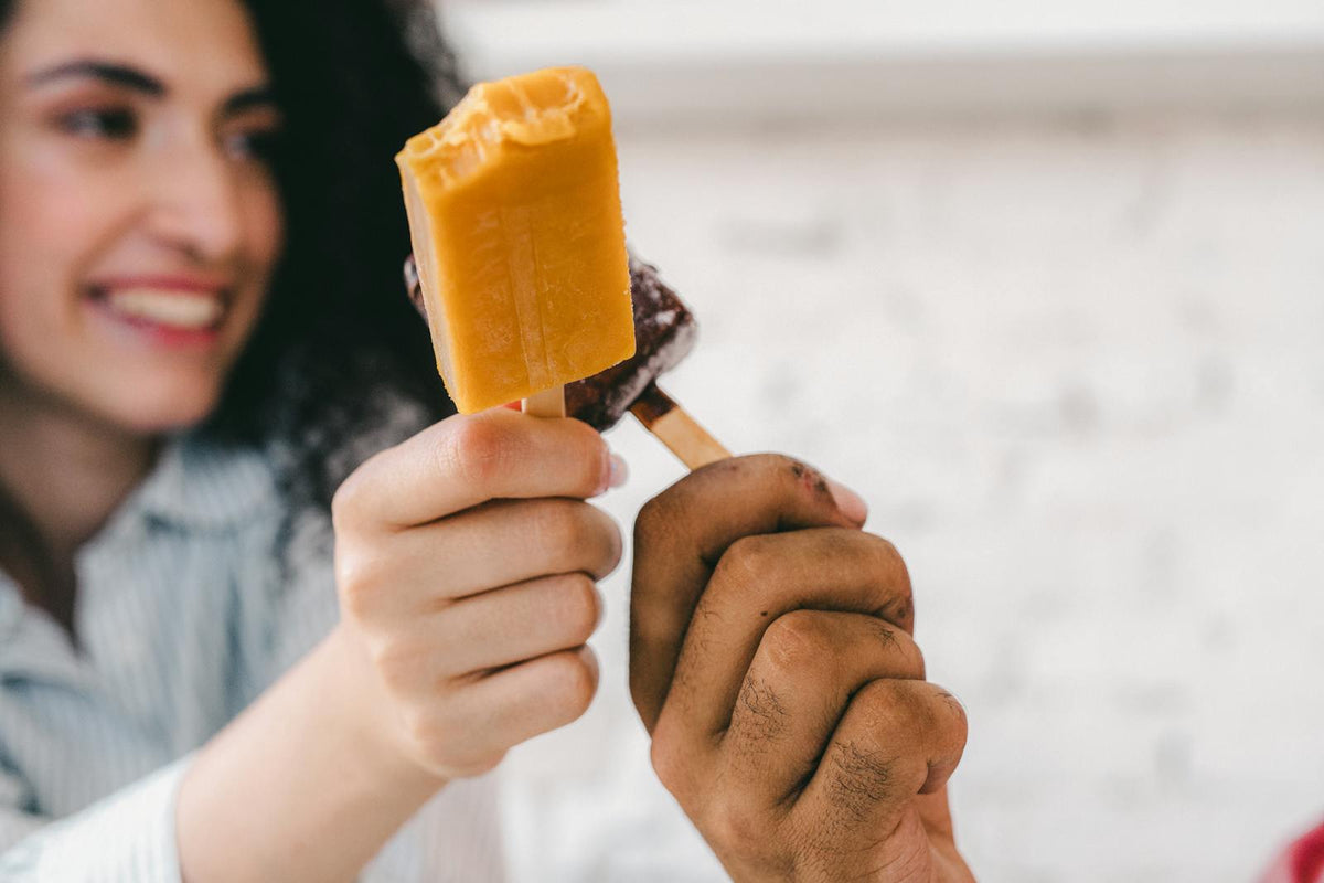 Friends enjoying ice cream bars together