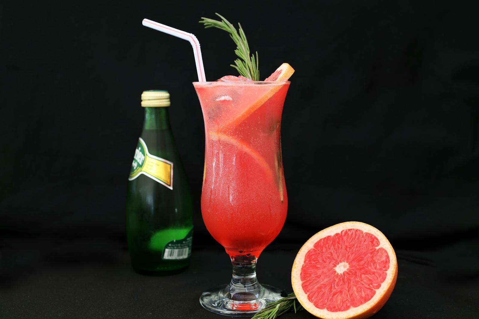 Refreshing grapefruit cocktail with rosemary garnish