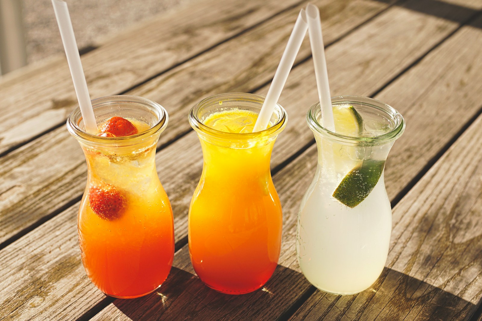 Colorful summer drinks on wooden table