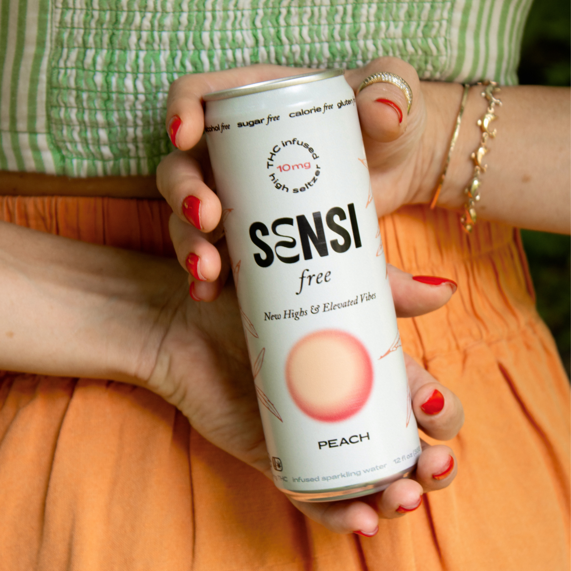 two hands grabbing a sensi peach behind their back