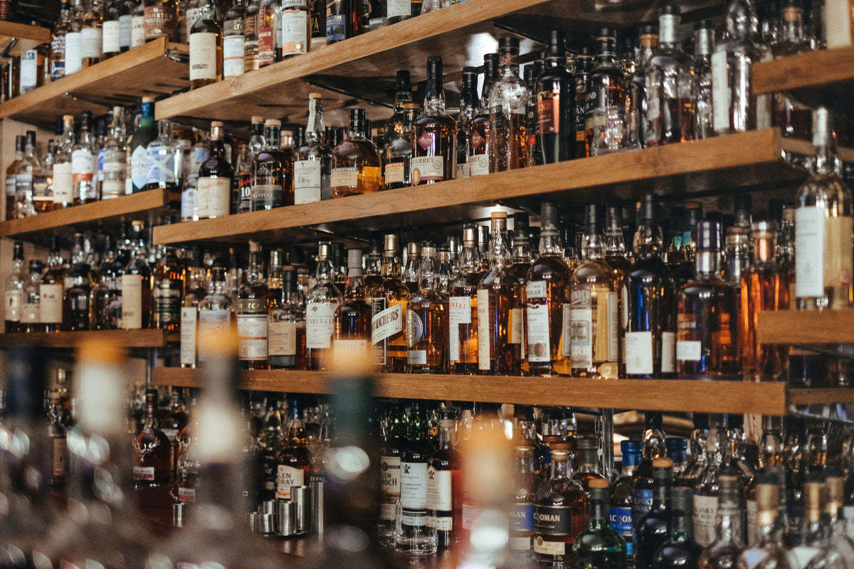 Bar shelves with various liquor bottles