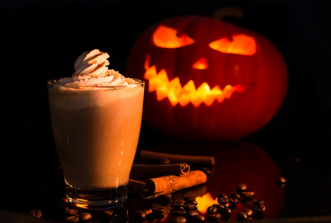 Latte with whipped cream and jack-o-lantern