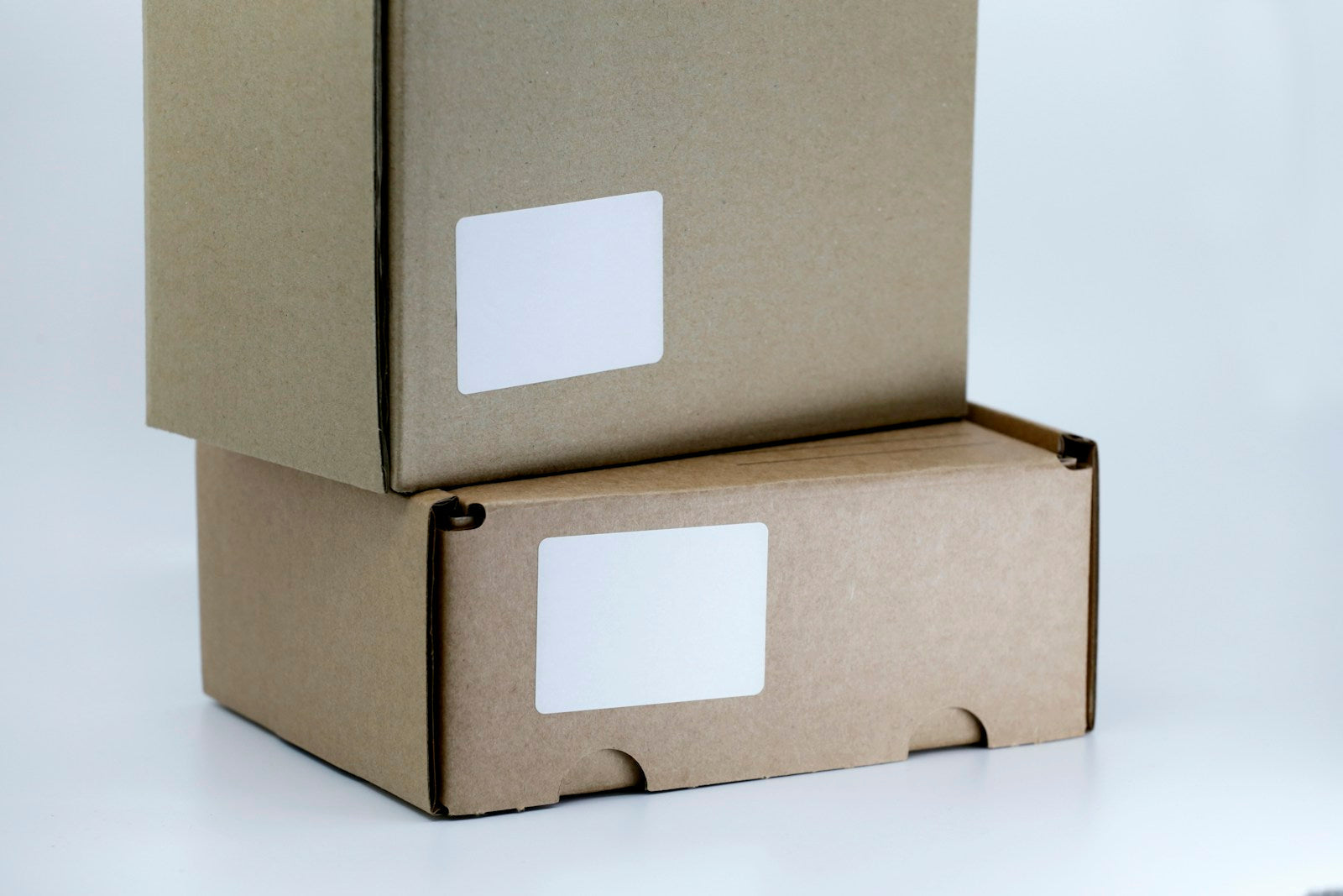 Stacked cardboard boxes with blank labels