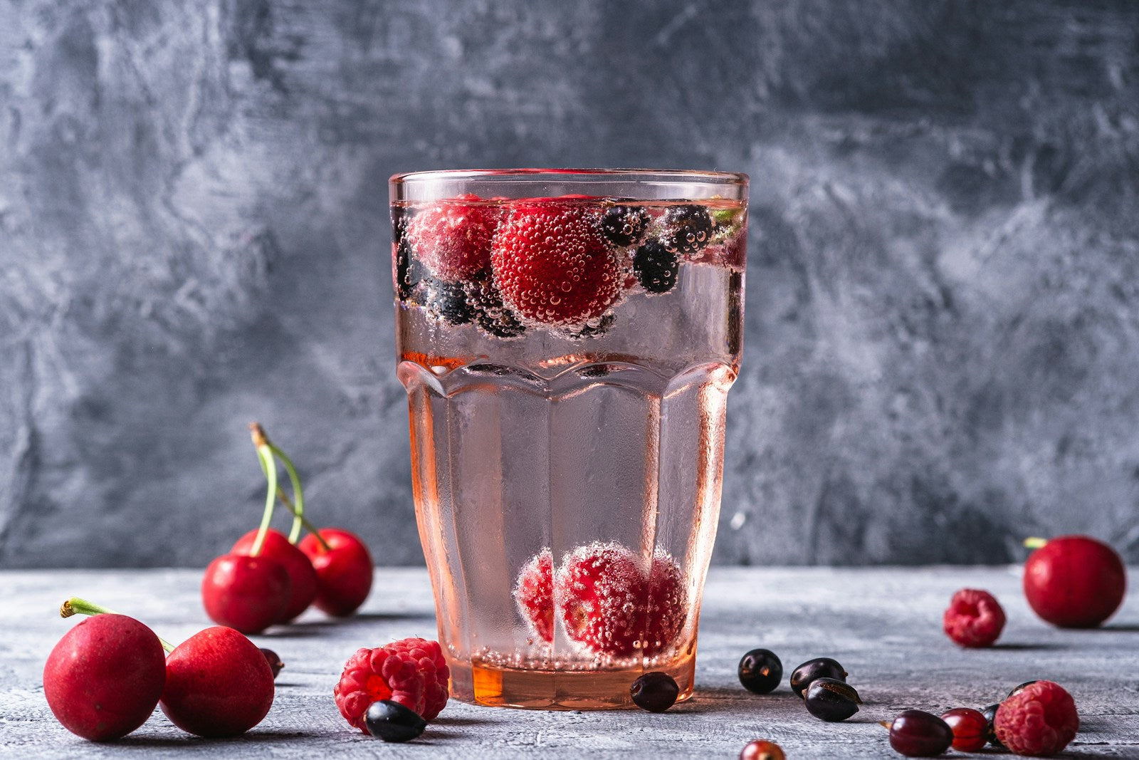 Sparkling berry water with fresh fruits
